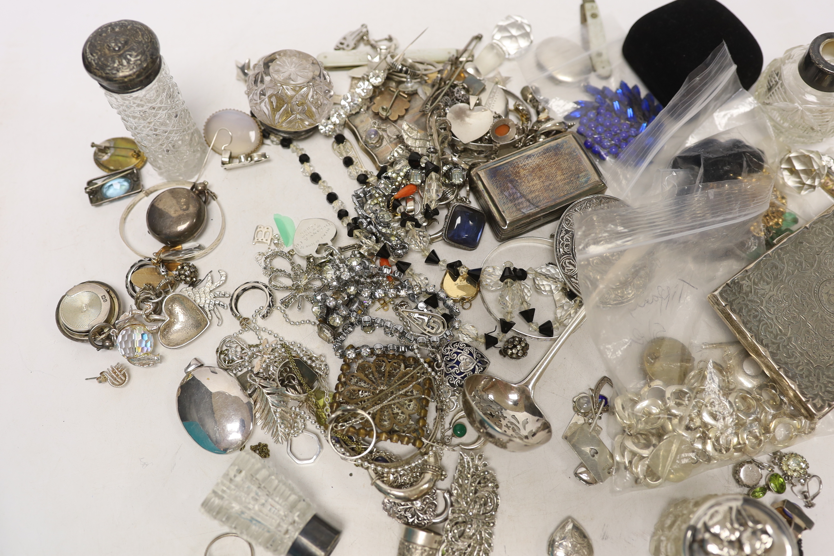 A group of assorted silver and jewellery, including a 19th century snuff box, sifter spoon and card case, a later toilet jar, scent bottle and sovereign case, necklaces, earrings and lockets including white metal and oth